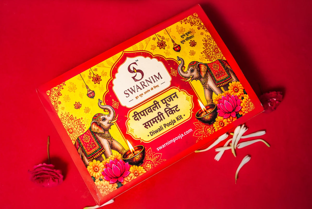 Swarnim Deepavali Poojan Samagri Kit photographed on its original red background with flowers