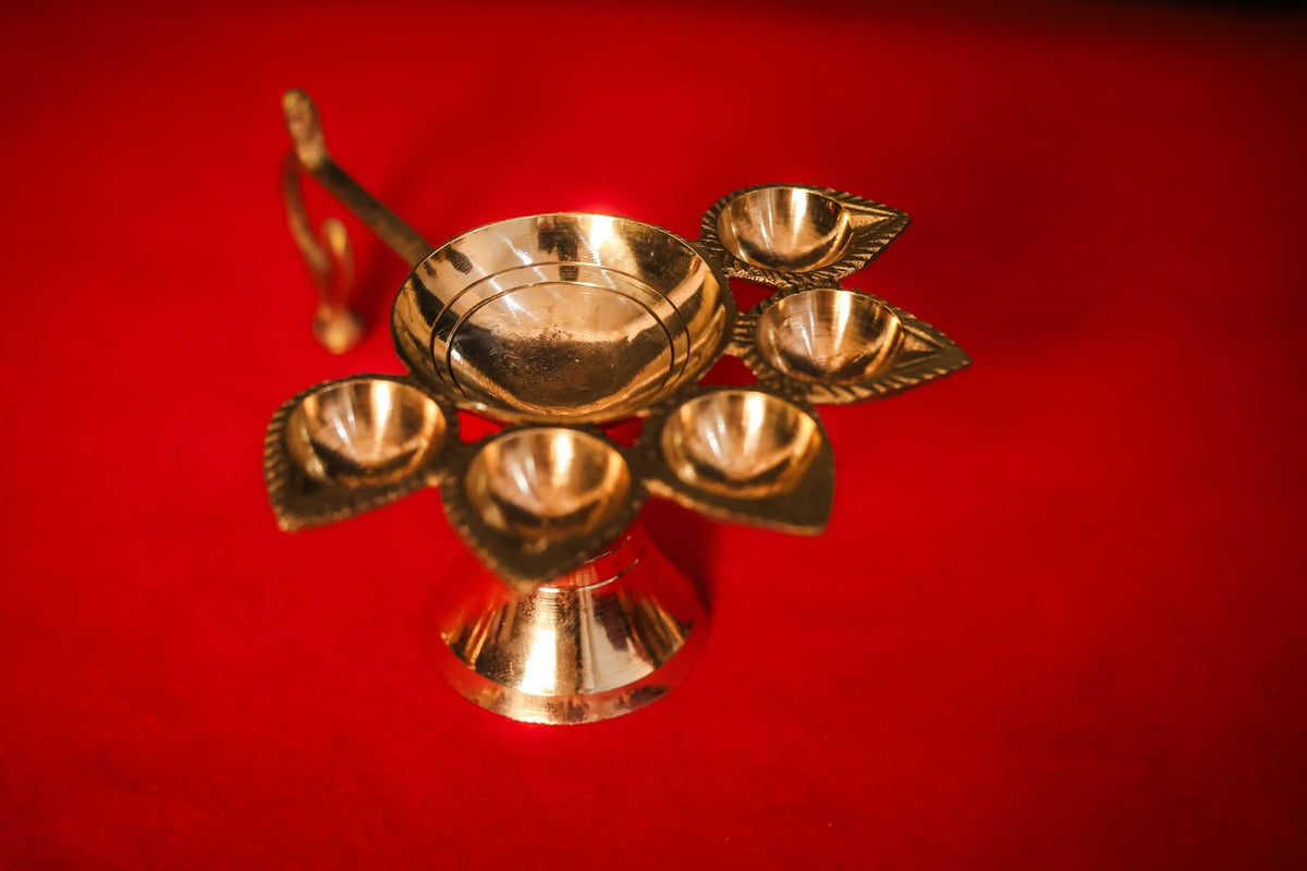 Brass Panchmukhi Aarti Diya, angled top view showing five wick bowls